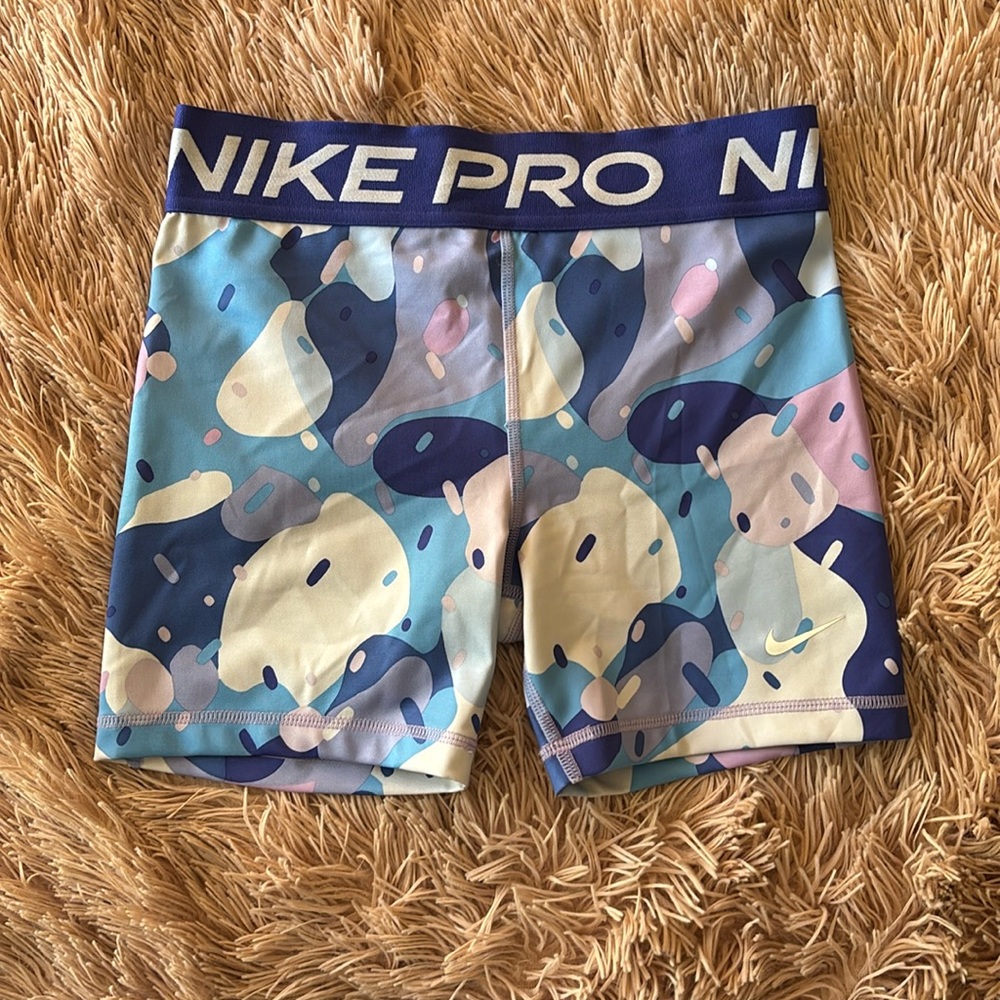 Purple and Blue Nike Pros 5”